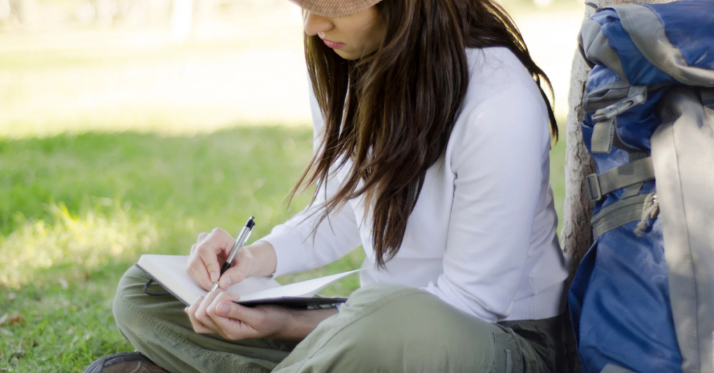 Finding strength after the divorce, Woman journaling in peaceful setting as a form of self-reflection and healing