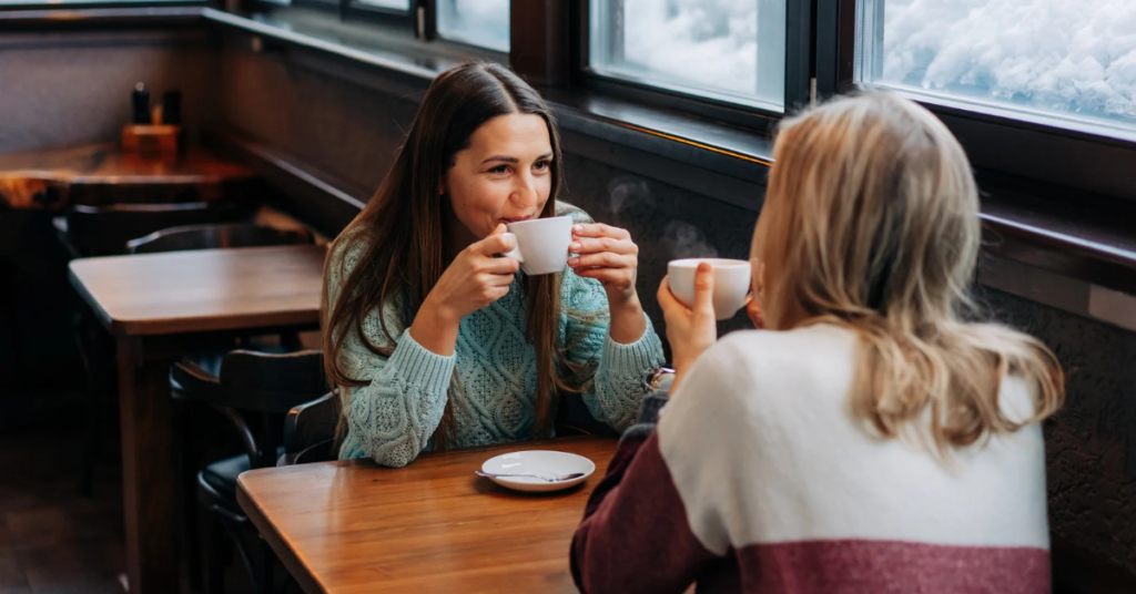 Supportive conversation between two women building meaningful relationships
