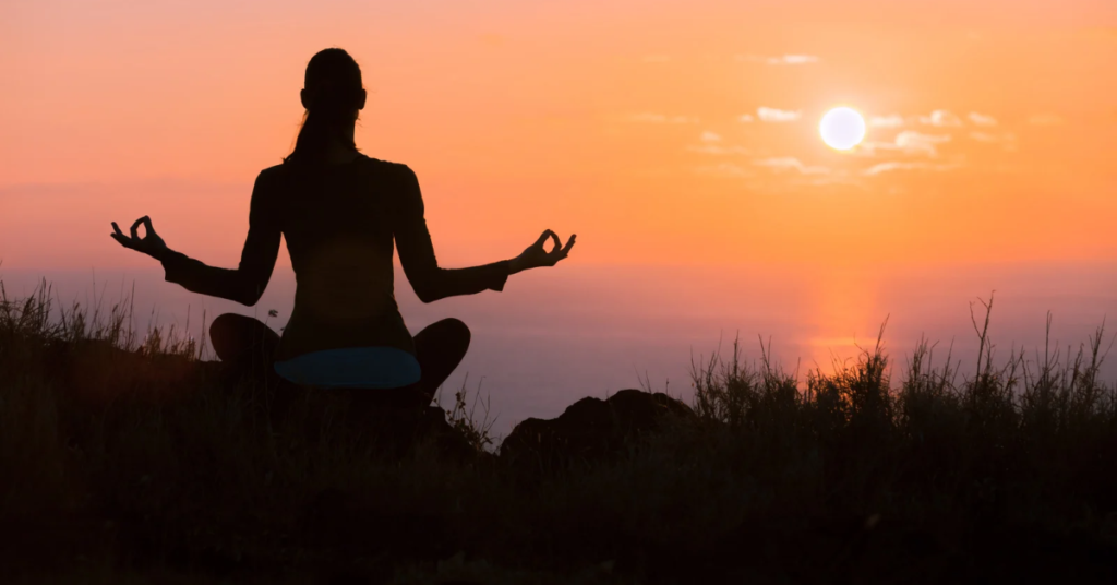 woman practicing mindfulness and meditation, embracing the practice of energy management for emotional healing: managing energy