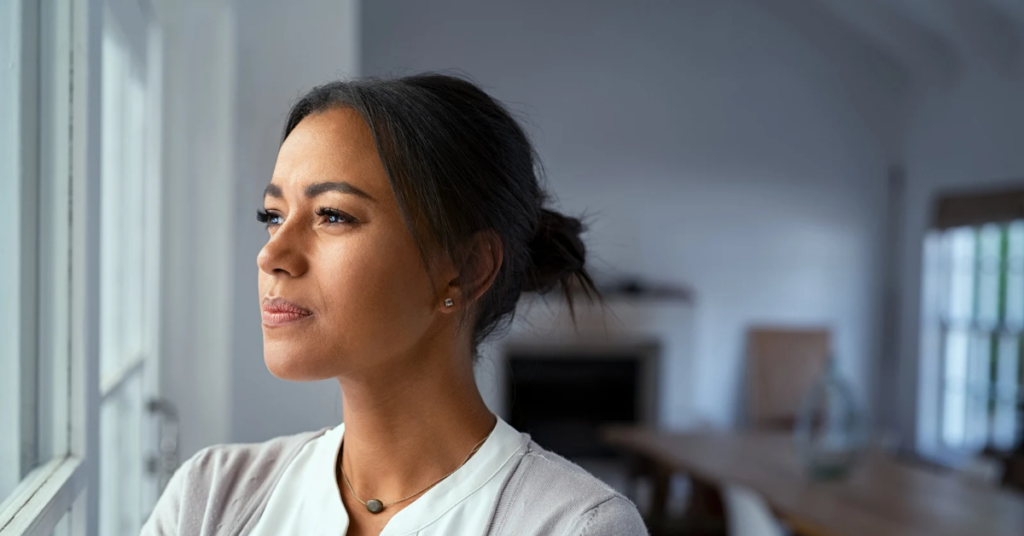 Woman reflecting on emotional triggers in relationship